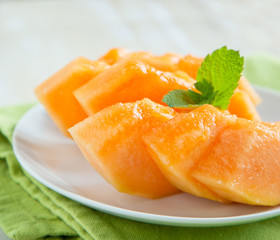 Fototapeta na wymiar Slices of cantaloupe melon