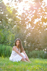 Beautiful woman on summer meadow