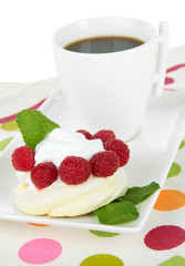 Tasty meringue cake with berries and cup of coffee, isolated