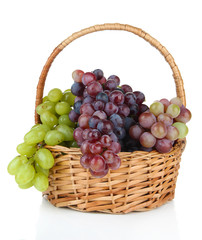 Fresh grape in wicker basket, isolated on white