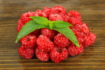 Fresh raspberry on wooden background