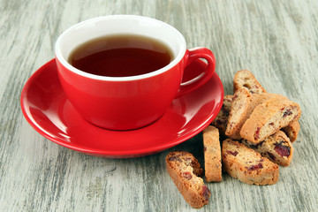 Cup of tea with cookies on table close-up