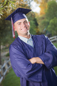 Handsome Male Graduate in Cap and Gown