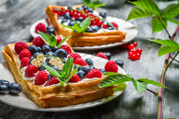 Waffels with cream and blueberry and raspberry