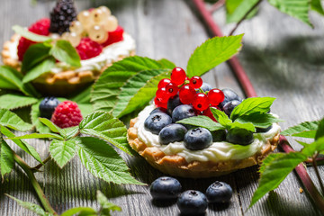 Small cupcake with fruits in forest