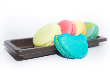 Macarons on a tray isolated in white background