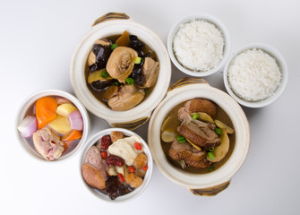 Chicken and herb soup in pot, Chinese food style.