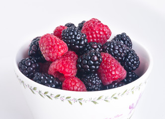 raspberry and blackberry on white isolated background