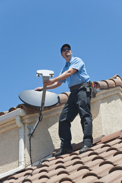 Satellite Installer on Roof.