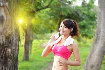 Healthy woman drinks water