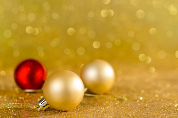 Fototapeta na wymiar Golden Christmas decoration and bokeh background with copy space