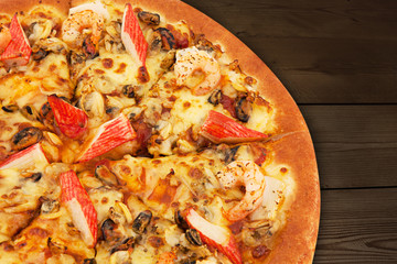 Delicious italian pizzas served on wooden table