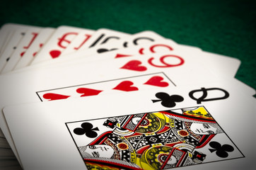 Playing cards - isolated on green background