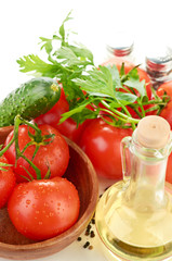 The branch of cherry tomatoes in a wooden bowl