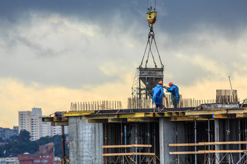 Pouring concrete into a newly built house