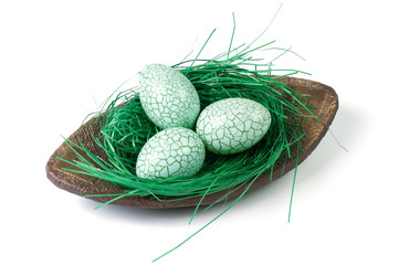 Naklejka na ściany i meble Green easter eggs on a decorative plate
