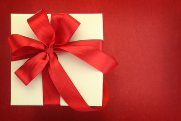 Close up of gift box on red background