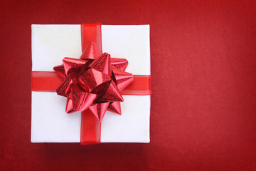 Close up of gift box on red background