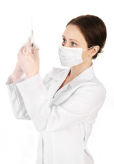 Young woman doctor with a syringe isolated