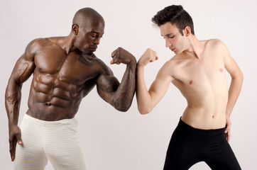 Fototapeta na wymiar White skinny man versus black bodybuilder