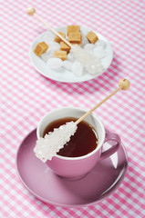 Cup with tea and sugar