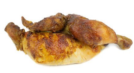 Half a grilled chicken on a white background