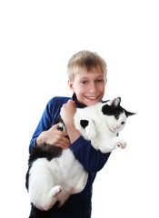 Beautiful happy blond boy holds a big fat cat