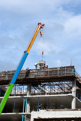 Construction site with crane and workers