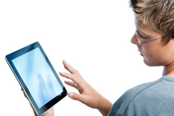 Boy typing on blank digital tablet.