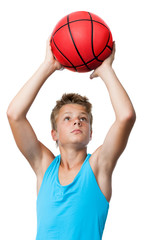 teen sportsman holding basketball.