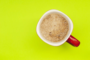 Cup espresso on a yellow-green background