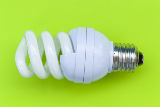 Energy saving bulb on a green background