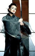 beautiful japanese kimono woman with samurai sword