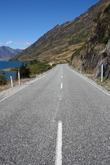 Road next to lake Hawea in New Zealand