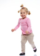 Happy little girl in pink knitted jacket