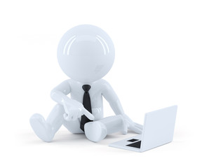 Business man sitting and using a laptop.