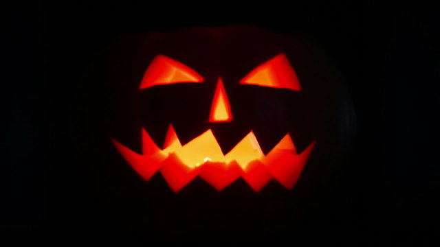 Scary halloween pumpkin jack-o-lantern candle lit