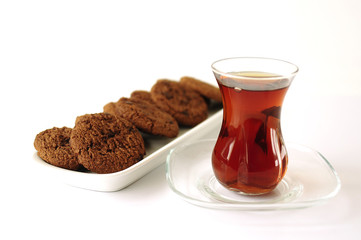 Turkish tea in traditional glass with cookies