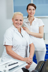 Female dentist and dental assistant