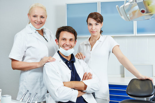Dentist with his dental team