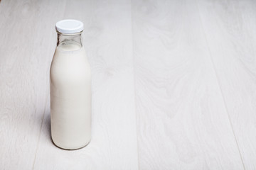 milk bottle on wooden background