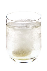 Fizzing pill tossed into the glass, dissolving