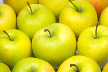 Many fresh tasty apples close up