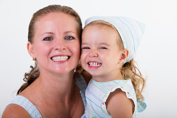Mother and daughter smile