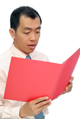 Surprised business man reading paper