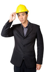 young foreman or engineer with yellow hard hat in suit isolated