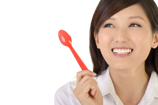 business woman holding tablespoon