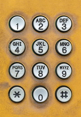 old dial pad of public telephone box