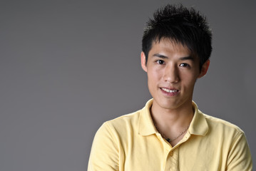 Obraz premium Happy smiling young man