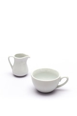 cup of coffee and milk jar